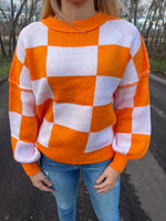 Load image into Gallery viewer, Orange Checkered Exposed Seam Sweater
